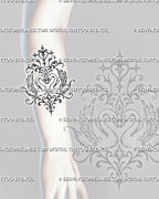 Swan heart tattoo shown on the forearm with two facing birds, curved necks, layered feathered wings, pointed stars, and ornamental scrollwork