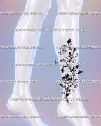 Trailing floral rose tattoo flowing from the ankle toward the calf with climbing rosebuds, curved leaves, spiral tendrils, and hand-drawn botanical ink