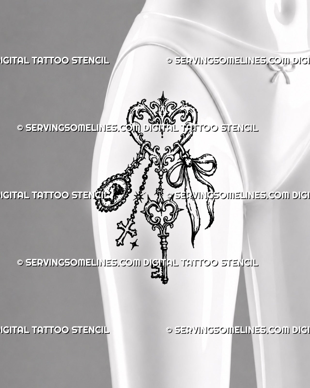 Vintage jewelry tattoo shown on a woman’s front thigh with a filigree heart key ring, antique key, cameo, cross charm, bow, and decorative chains