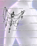 Vintage shoulder jewelry tattoo shown on a woman’s outer shoulder with draped chains, flaming heart, keyhole, skeleton key, ribbon bow, and gothic charms