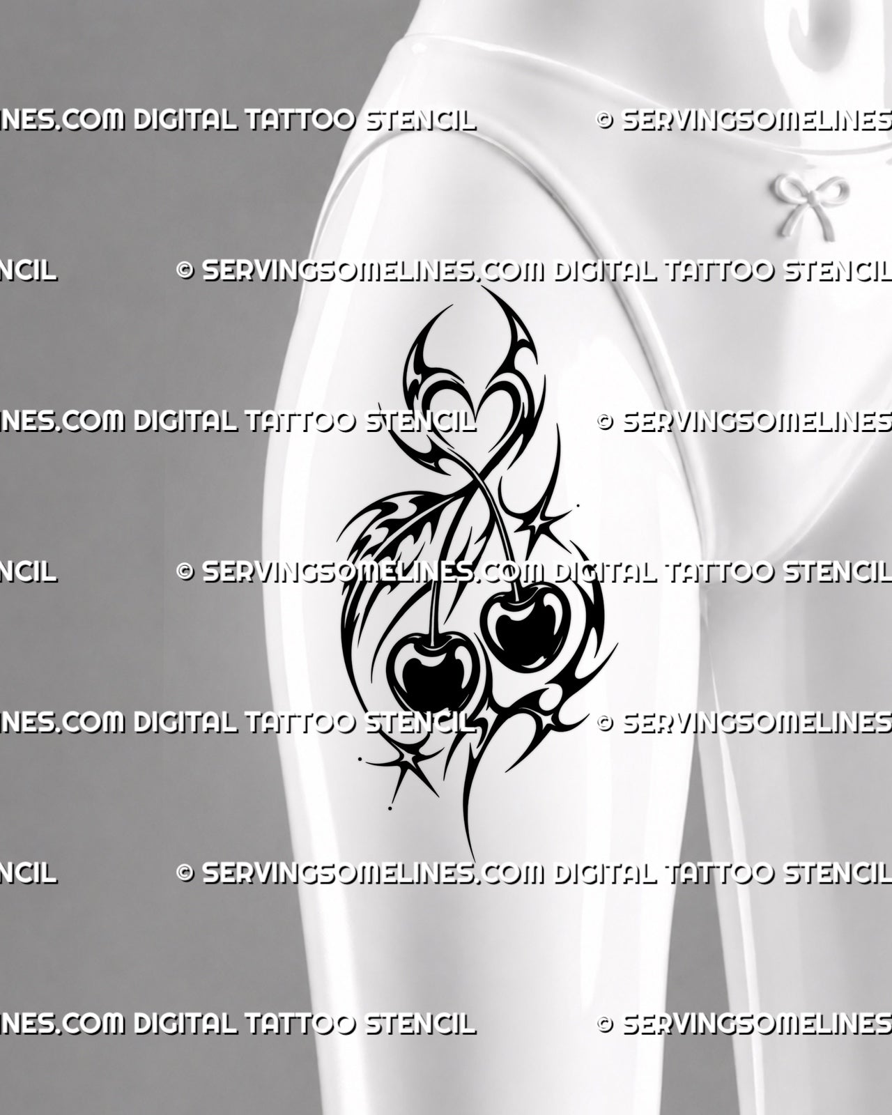 Y2K neotribal cherry tattoo shown on women’s thigh with twin cherries, bold black curves, crossed stems, pointed ornament, and heart-shaped detail