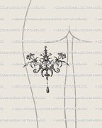 Cybersigil pendant tattoo stencil on the back of a woman’s thigh with moon, star and drop elements shown as a fine line placement example