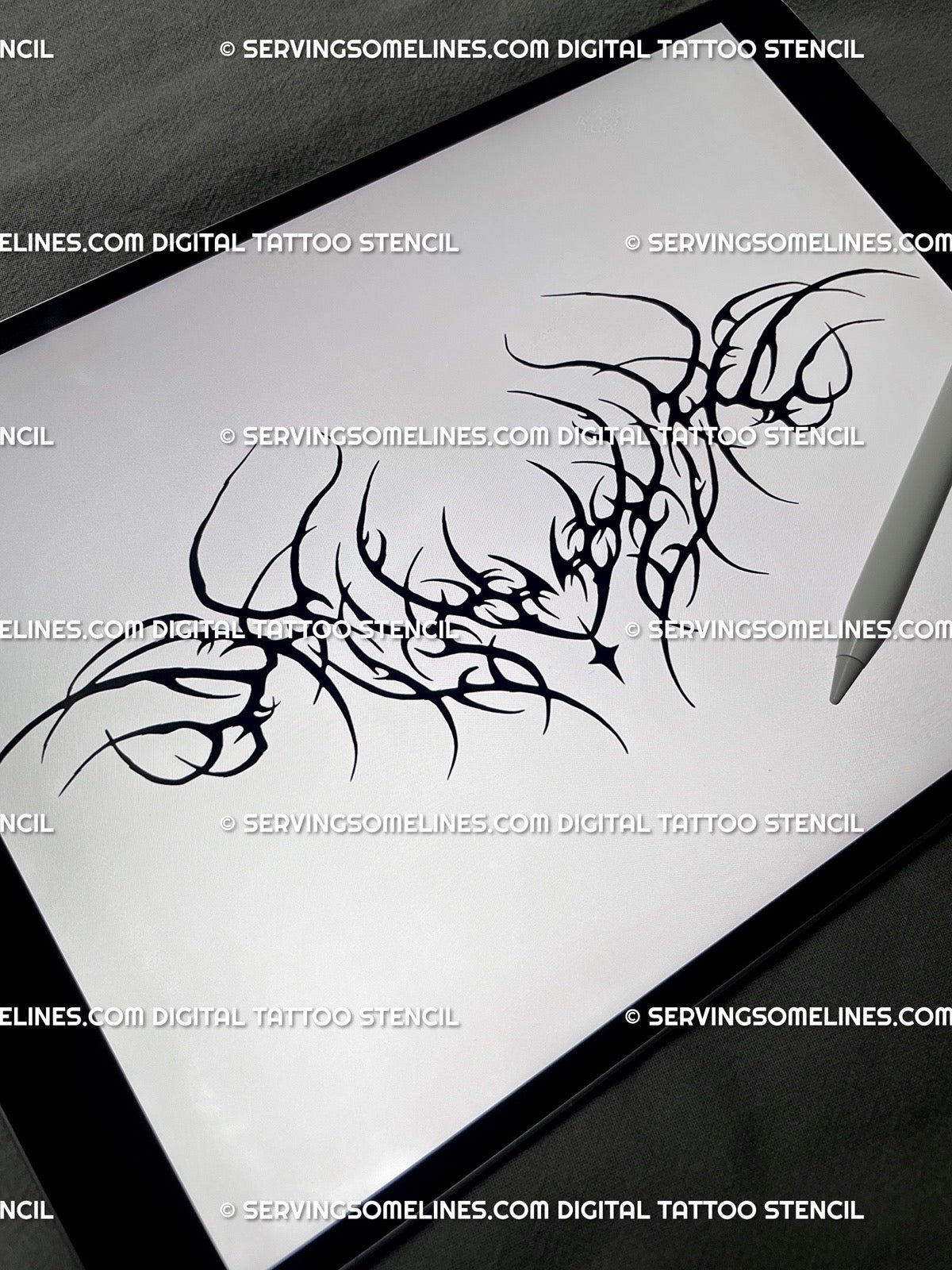 iPad preview of the black neotribal lower back tattoo stencil showing the full waist-built layout and pointed linework