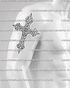 Celtic cross tattoo stencil shown on men's bicep, with bold ringed cross shape, interlaced knotwork, and high contrast detail.