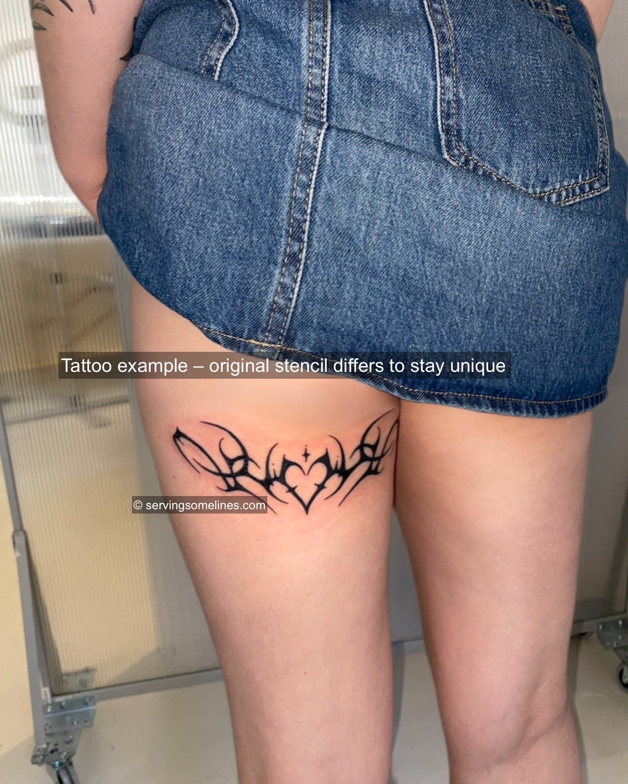 Real cyber sigilism tattoo stencil example tattooed on woman’s back thigh, heart tribal design with ornamental spikes and alt aesthetic. 