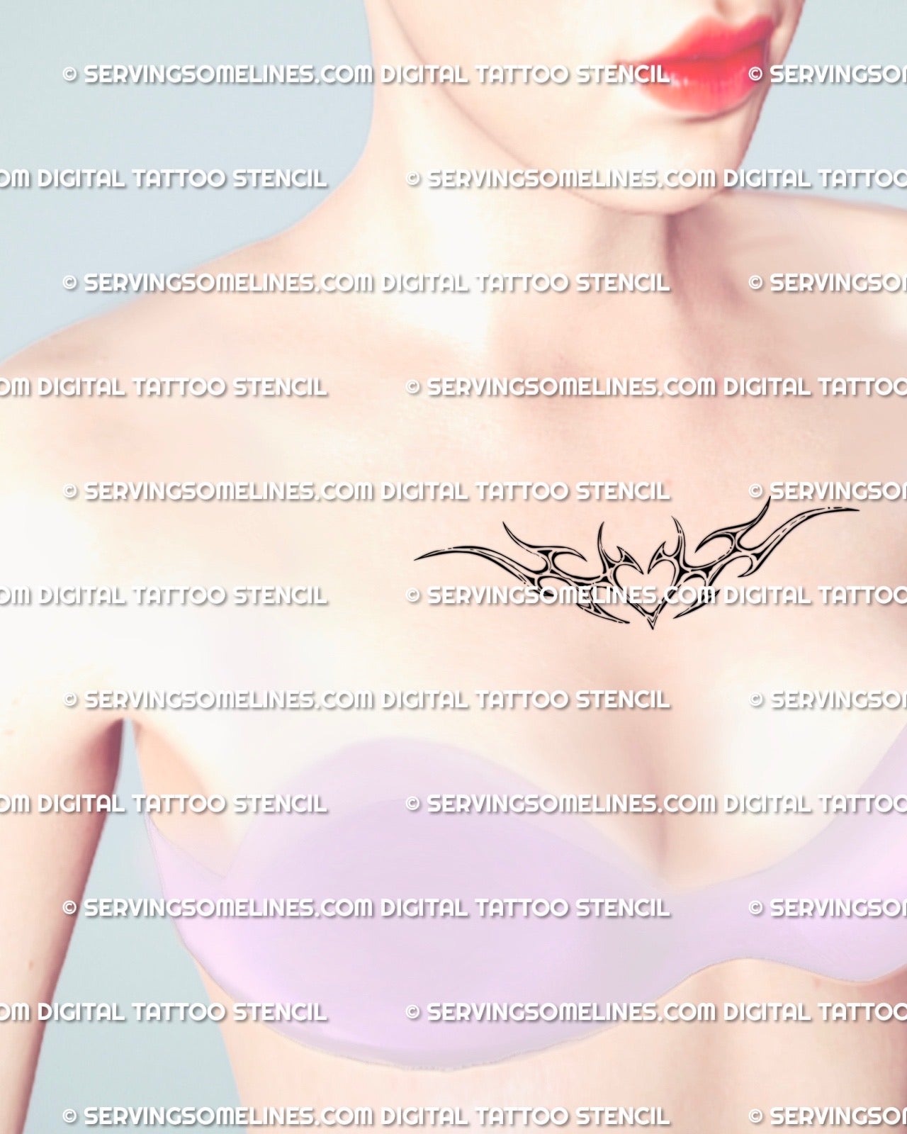 Small cyber tribal heart tattoo stencil shown on woman’s chest center, digital feminine design with spiked wings and clean ornamental symmetry.