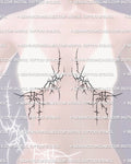 woman display showing an abstract cybersigil underbreast tattoo stencil across the sternum with mirrored dripping lines and hidden heart shapes