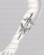 Flame dagger tattoo stencil shown on forearm placement, dagger-first silhouette, crisp transfer.