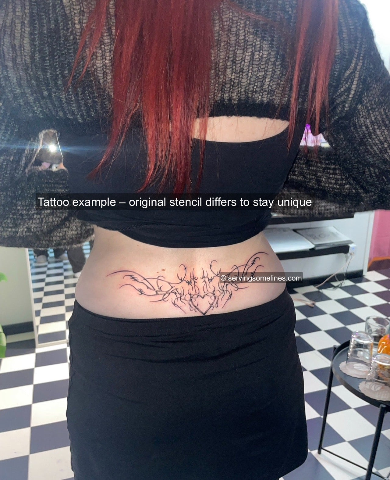 Dark feminine heart lower back tattoo shown on skin on women's lower back placement using this stencil design.