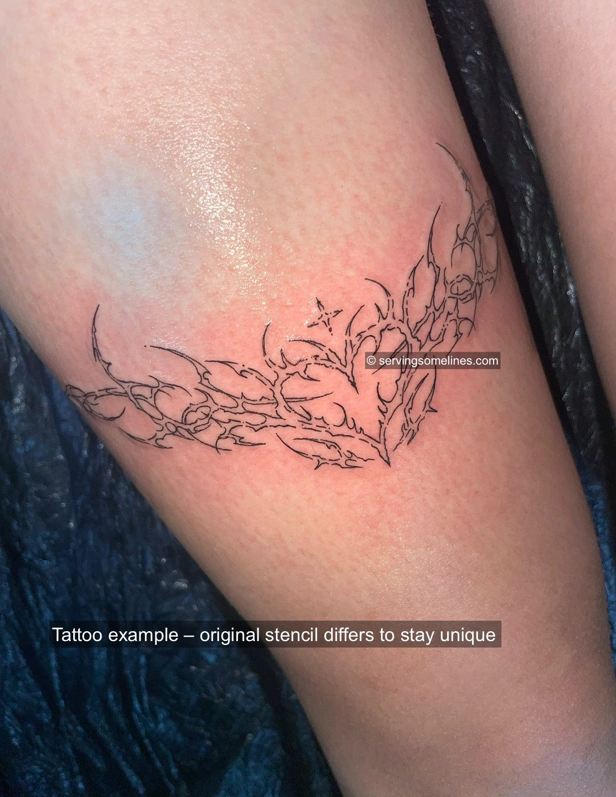 Feminine heart wings tattoo on woman’s front thigh, ornamental cybersigilism linework with baroque lineart.