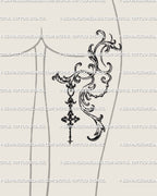 Baroque filigree tattoo design displayed on the back of a woman’s thigh, gothic yet feminine with delicate ornamental detail. 