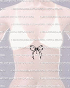 girl displaying a gothic bow tattoo stencil with a devil heart motif placed along the sternum for elegant feminine body framing