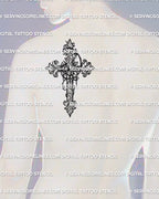 Gothic baroque cross tattoo stencil displayed on mens shoulder back, strong ornamental filigree lines and classic scroll details