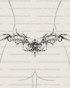 Gothic lower back tattoo shown on womens waist placement, with thorned framing, dark center detailing, and a wide side spread.
