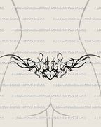 Gothic ornamental heart lower back tattoo shown on women's lower back placement example with a centered heart and spiked framing.