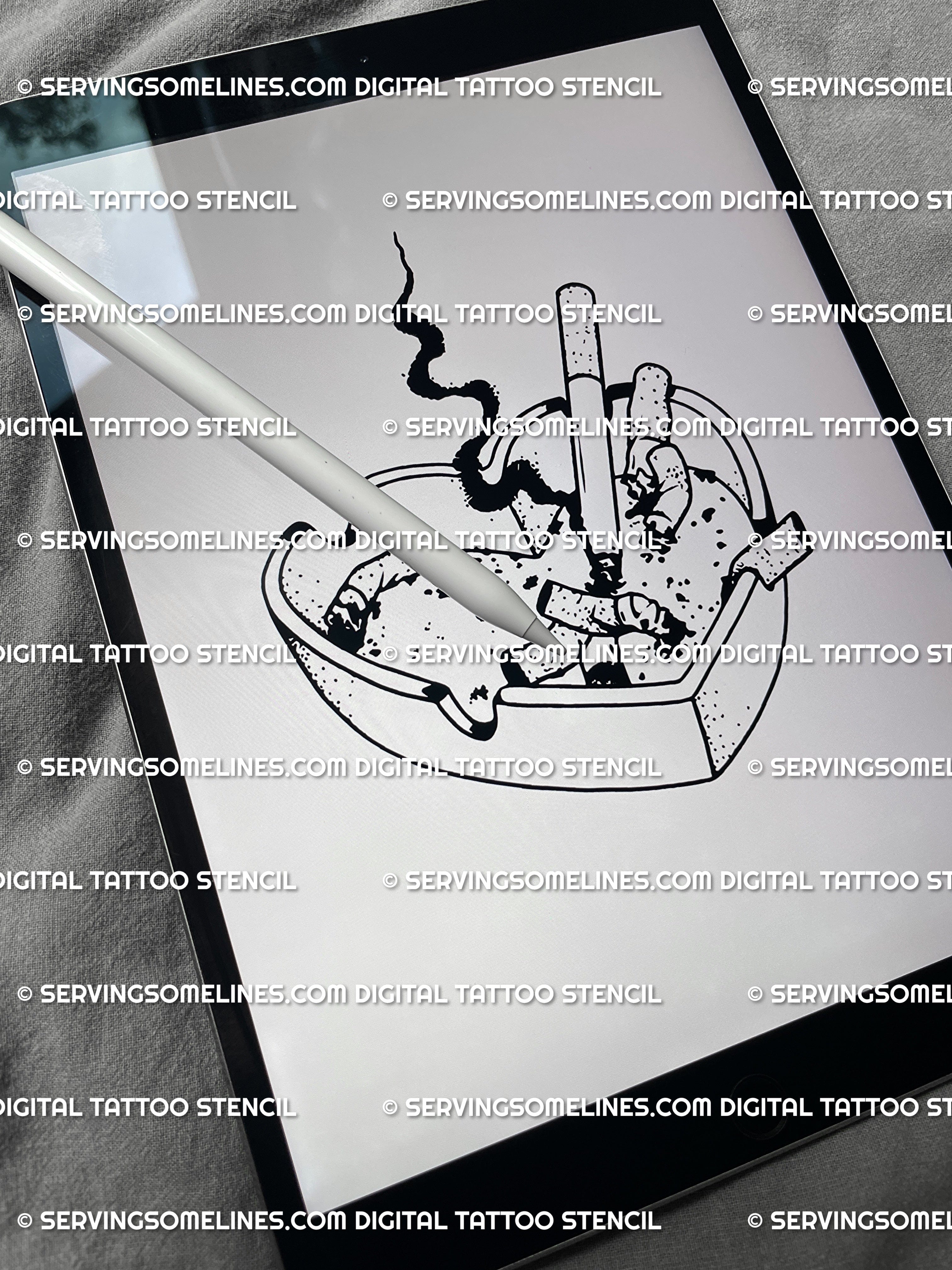 Digital ashtray heart tattoo stencil preview on iPad screen, modern grunge blackwork design showing heart-shaped ashtray full of cigarettes.