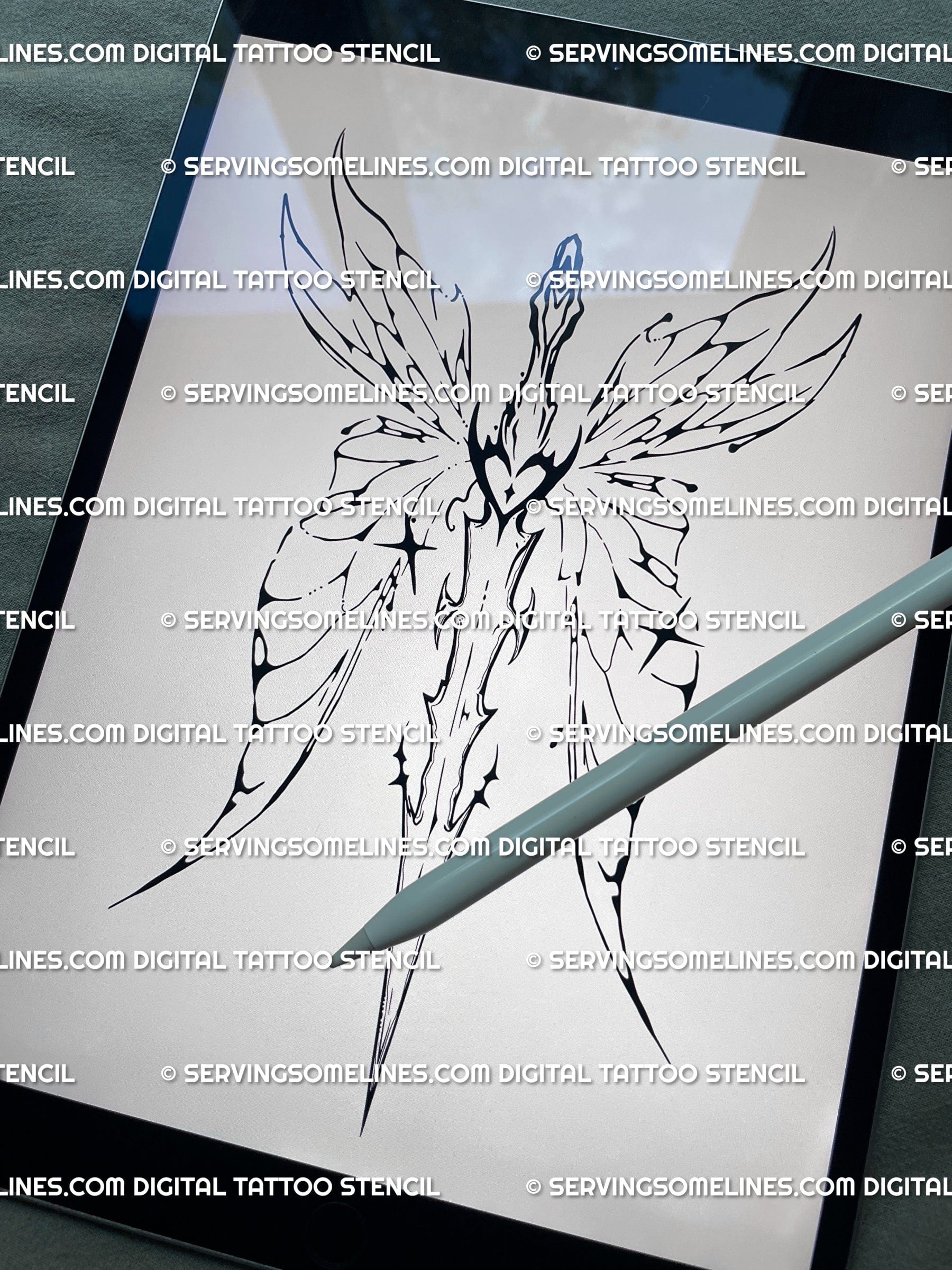 Digital preview of the feminine backpiece tattoo stencil, showing the fairy winged sword and cyber-tribal spine design on iPad screen.