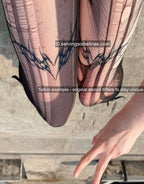 Neotribal heart matching tattoos shown healed on front thigh skin, based on this stencil design