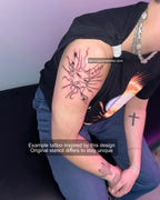 Tattooed cybersigilism sun on male shoulder, spiky tribal rays and gothic linework forming futuristic celestial symbol with bold symmetry.