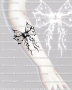 Ornamental gothic bow tattoo stencil on forearm placement, vertical ribbon design built for clean stencil transfer
