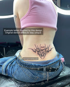 Real tattoo example of angel lettering word design on lower back, fine neotribal cyber font with halo accent and sharp symmetrical flow.