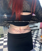 Pisces heart tattoo on woman’s lower back, elegant neotribal cybersigilism design showing water-sign fluid energy.