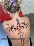 Real tattoo on woman’s spine using bat wings sword digital stencil, gothic neotribal blade inked with cyber sigilism detailing and heart center.