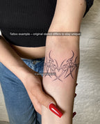 Real tattoo photo, Sagittarius heart tattoo stencil used on forearm placement, neotribal horn frame with arrow points.