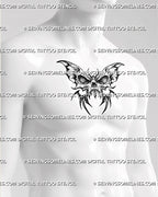 Skull butterfly tattoo stencil shown on mens chest center placement, strong dark butterfly silhouette with clear skull detail.