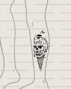 Skull ice cream tattoo shown on leg placement, creepy cute gothic style cone design perfect for thigh or calf tattoo idea.