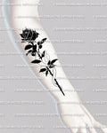 Snake and rose tattoo meaning shown on forearm, gothic neotribal floral design symbolizing balance, emotion, and inner strength.