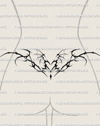 Winged succubus heart tattoo shown on feminine lower back placement example, with a pointed center and spread wings.