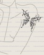 woman’s upper arm showing a gothic butterfly wing tattoo design with spiky ornamental shapes and dark abstract linework 
