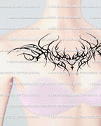 neotribal blackwork chest tattoo stencil shown on womens mannequin chest, highlighting how the design curves under the collarbones