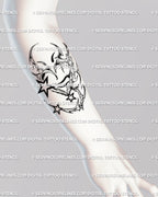 Y2K chrome heart tattoo with tribal stars on forearm, cyber sigilism linework design for modern edgy tattoo aesthetic.